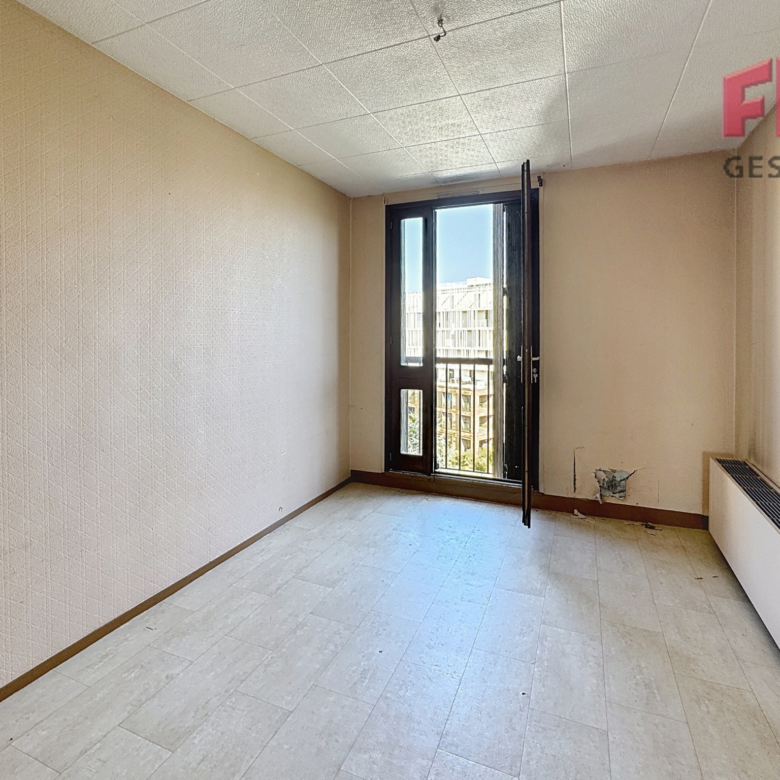 T3 balcon et place de parking